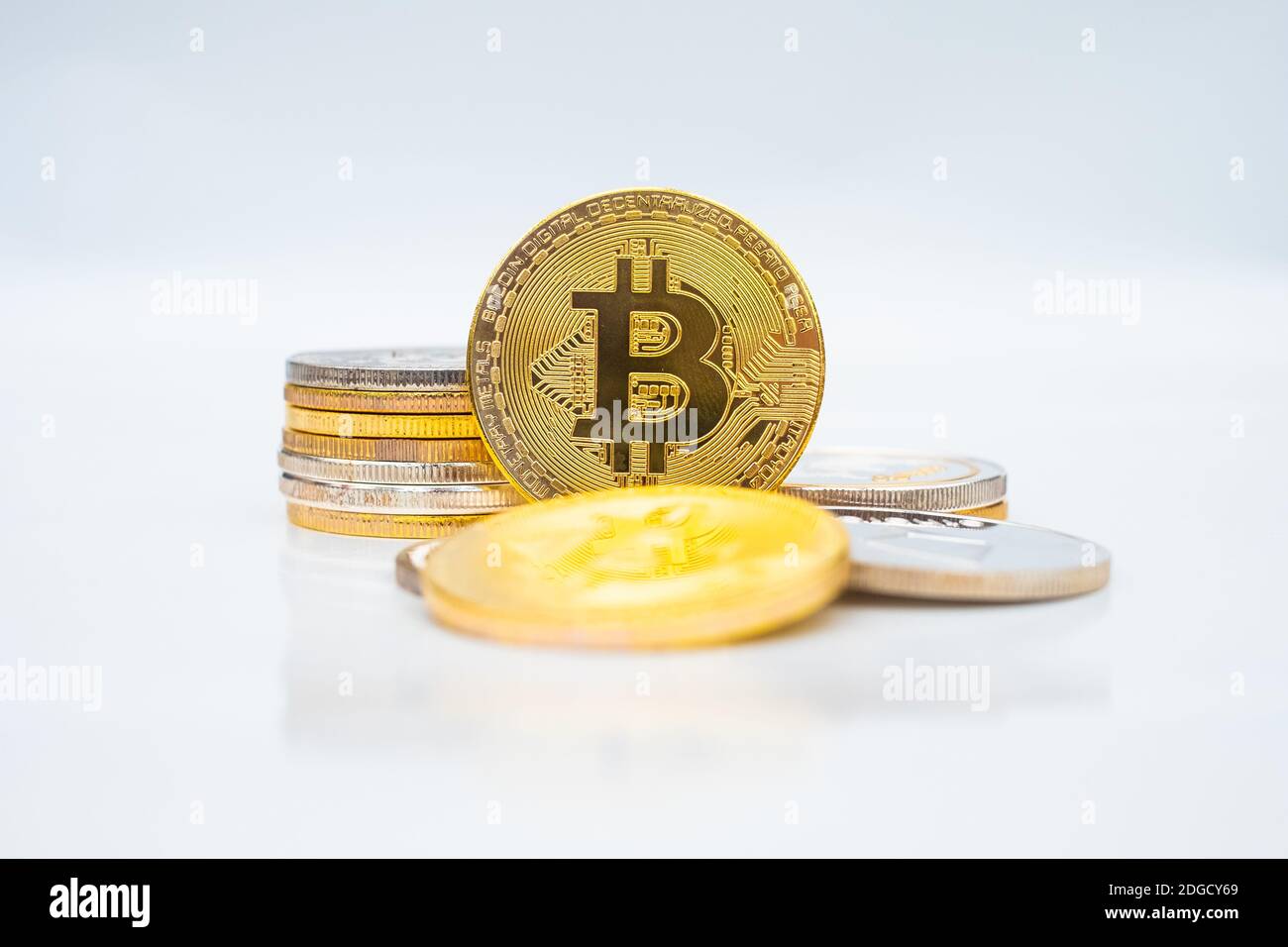 Bunch of Crypto currency coins with focus on BTC Bitcoin Stock Photo