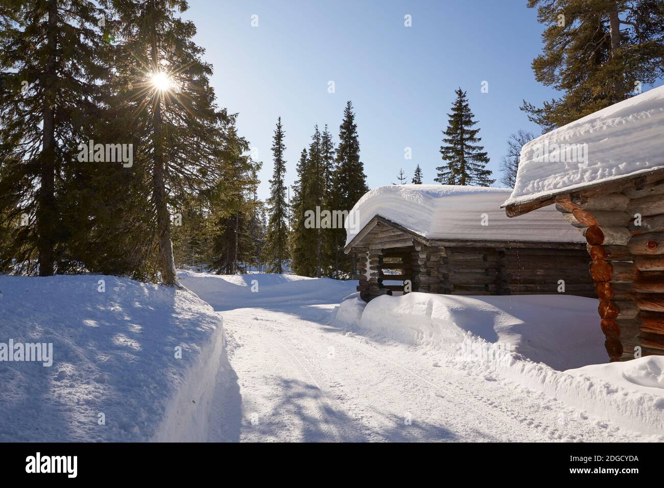 Snowman with Moustache in front of Log cabin in Lapland, Arctic Circle, Finland Stock Photo