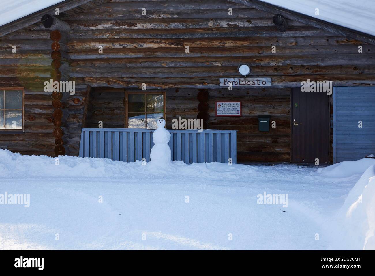 Snowy Log Cabin in the Sun in Lapland Stock Photo - Alamy