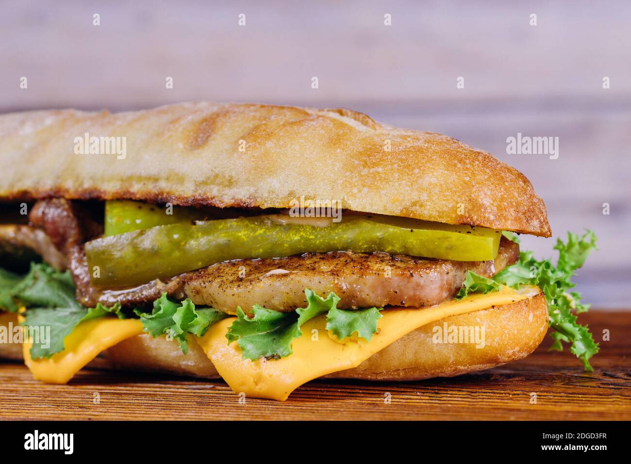 Sandwich with lettuce, slices of pickles, and cheese Stock Photo Alamy