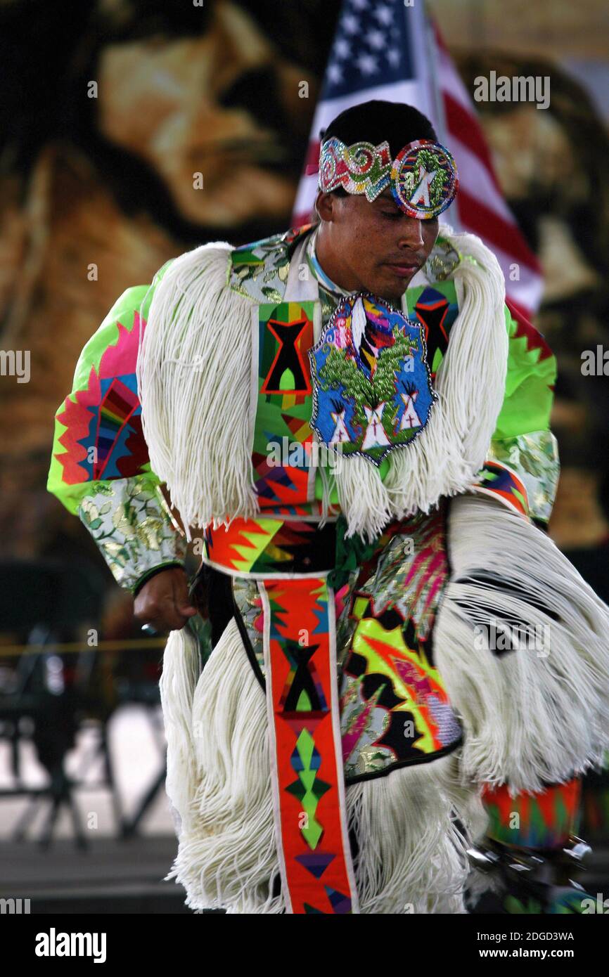 A Native American performs a traditional dance during a pow wow Stock Photo