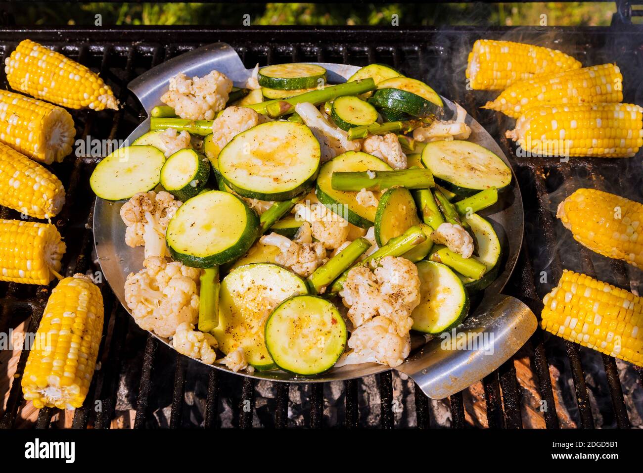 Corn, zucchini, asparagus and cauliflower on grill. Stock Photo