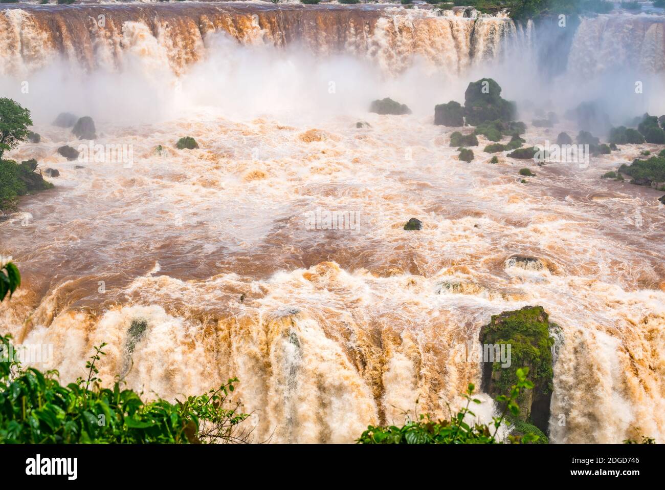 View of the powerful rapids of Iguazu River at the beautiful Iguazu Falls Stock Photo