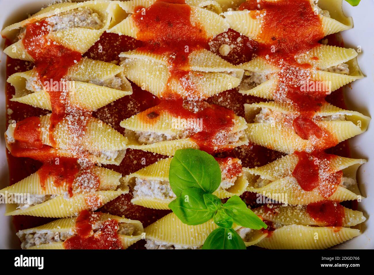 Jumbo shells pasta stuffed with meat, ricotta, tomato sauce Stock Photo