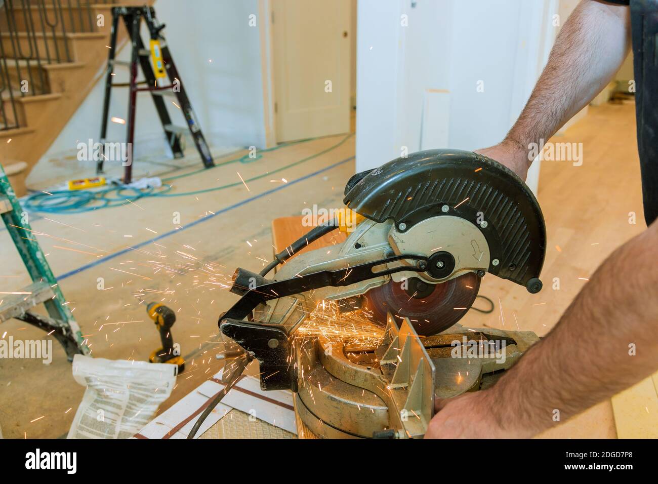 Worker cutting metal with grinder. Sparks while grinding iron Stock