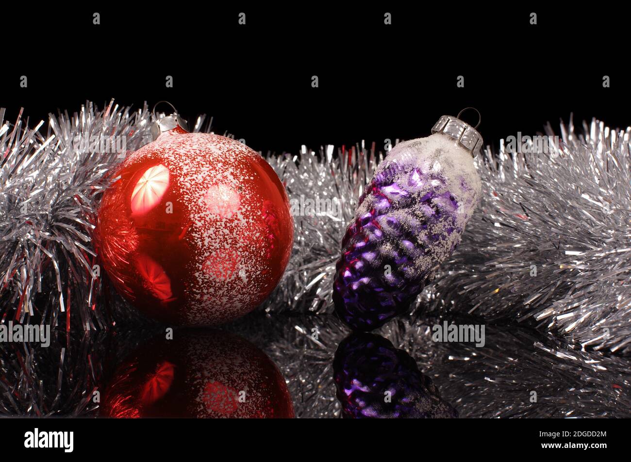 Two retro vintage Christmas Tree ball decorations isolated on the black