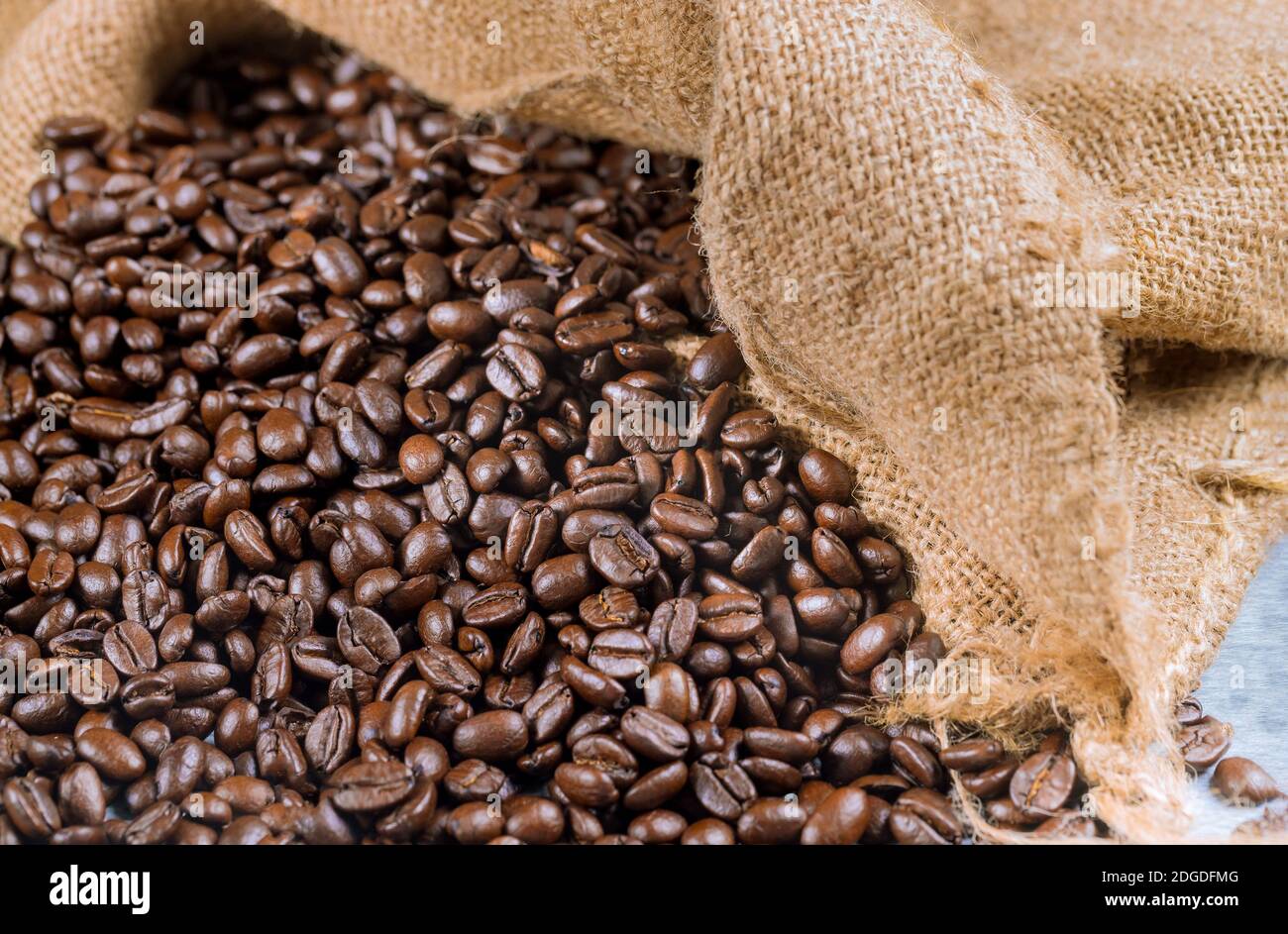 Coffee beans in a bagging. Close up. Stock Photo