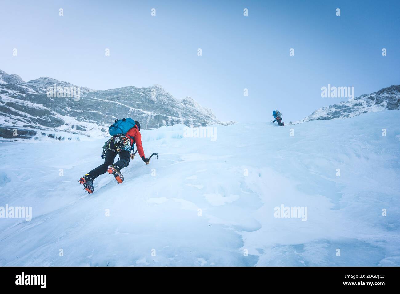 Two men freesolo an alpine ice climb in Maine Stock Photo Alamy