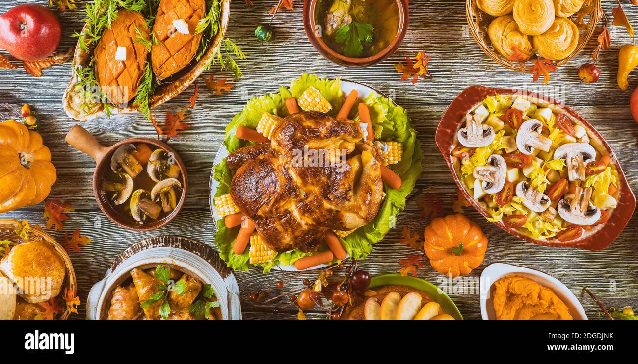 Thanksgiving dinner setting on rustic wooden table. Stock Photo
