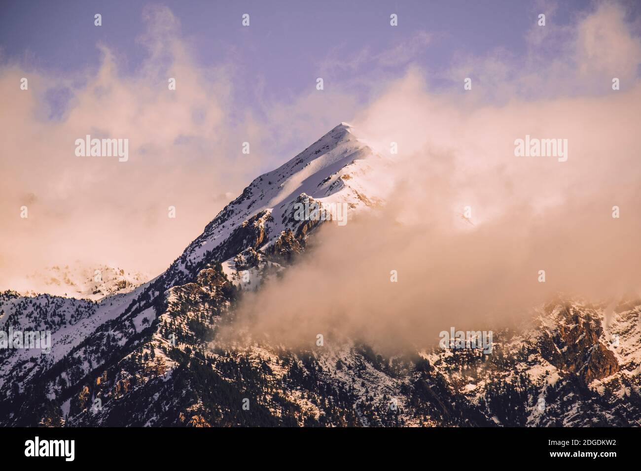 Scenic view of snowcapped mountain against cloudy sky in the Pyrenees at sunrise, Panticosa, Huesca, Spain Stock Photo