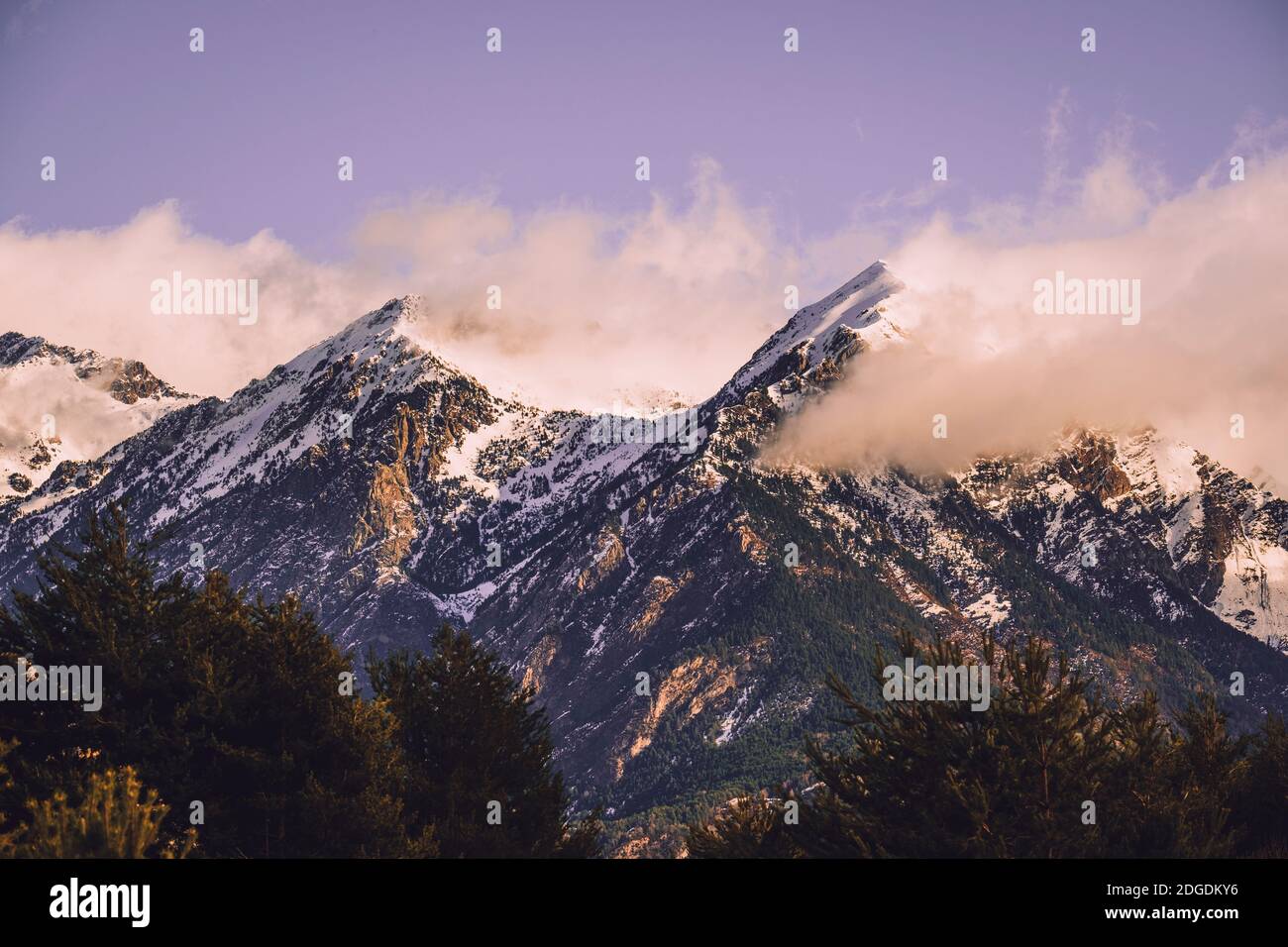 Scenic view of snowcapped mountains against cloudy sky in the Pyrenees at sunrise, Panticosa, Huesca, Spain Stock Photo