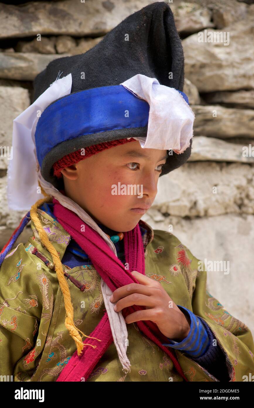 Local Ladakhi child in traditional dress, attendee of the Zanskar or