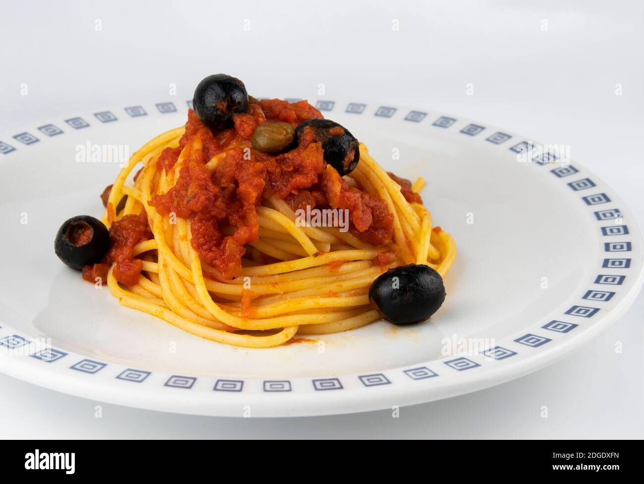 Spaghetti alla puttanesca, with olives, anchovies and capers Stock Photo