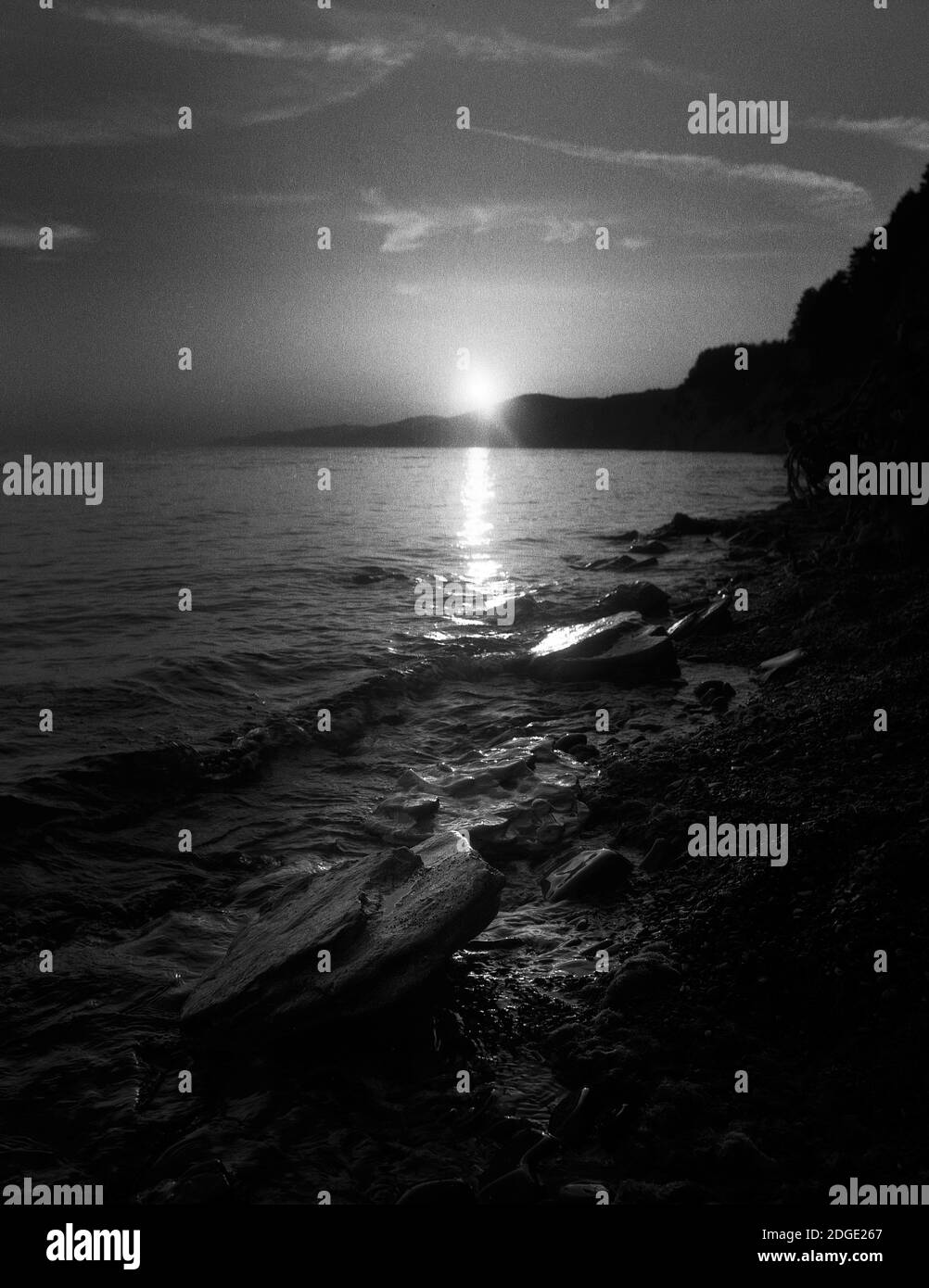 Sunset rocky shore Black and White Stock Photos & Images - Alamy