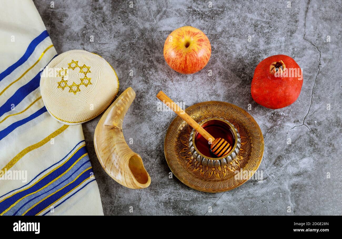 A jewish new year with honey for the apple and pomegranate holiday of Rosh Ha Shana Stock Photo