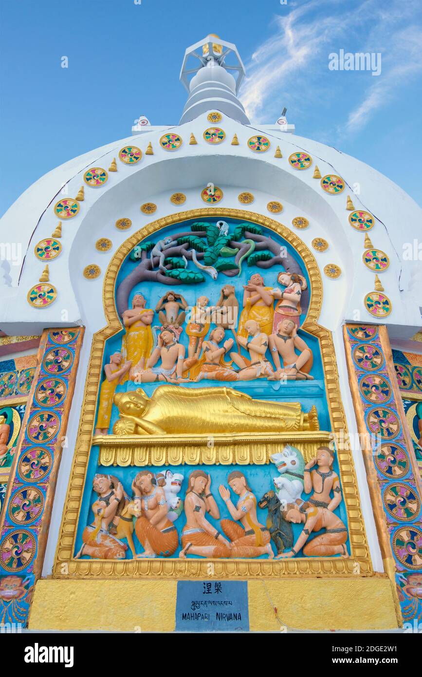 Detail of stucco ornamentation of Shanti Stupa. Built in 1991 by Japanese Buddhist Bhikshu, Gyomyo Nakamura & part of the Peace Pagoda mission. The Shanti Stupa holds the relics of the Buddha at its base, enshrined by the 14th Dalai Lama Ladakh, Jammu and Kashmir, India. Facade entitled MAHAPARI NIRVANA Stock Photo