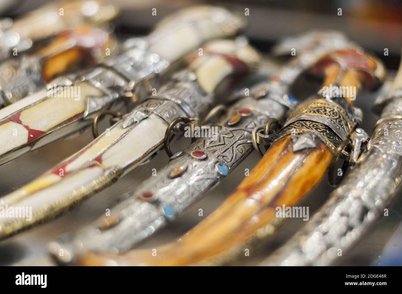 Background of different oriental daggers in a souk. Stock Photo