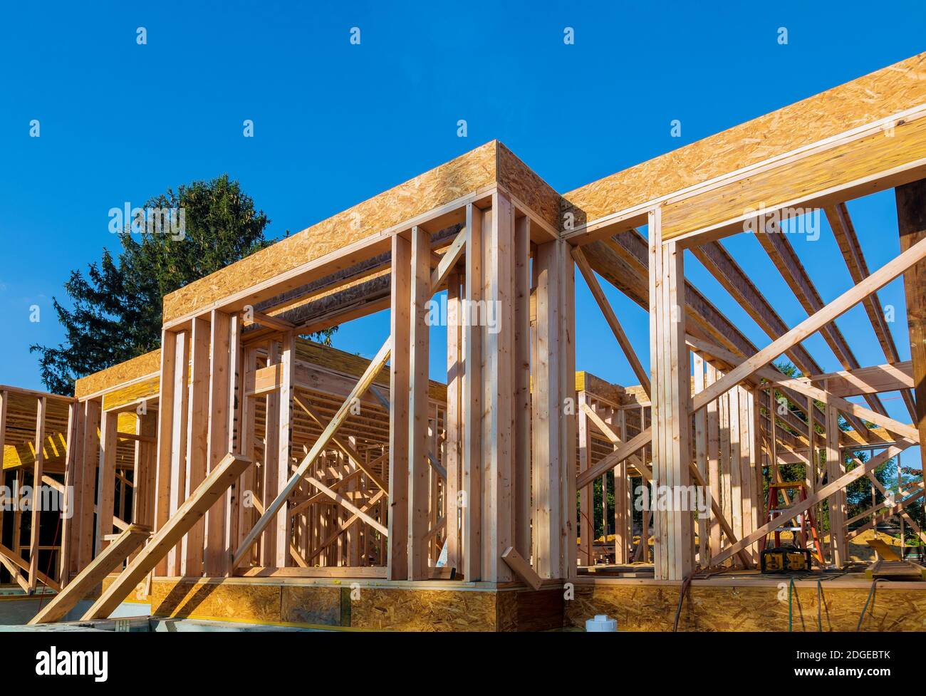 Wood frame work of new residential home under construction. Stock Photo