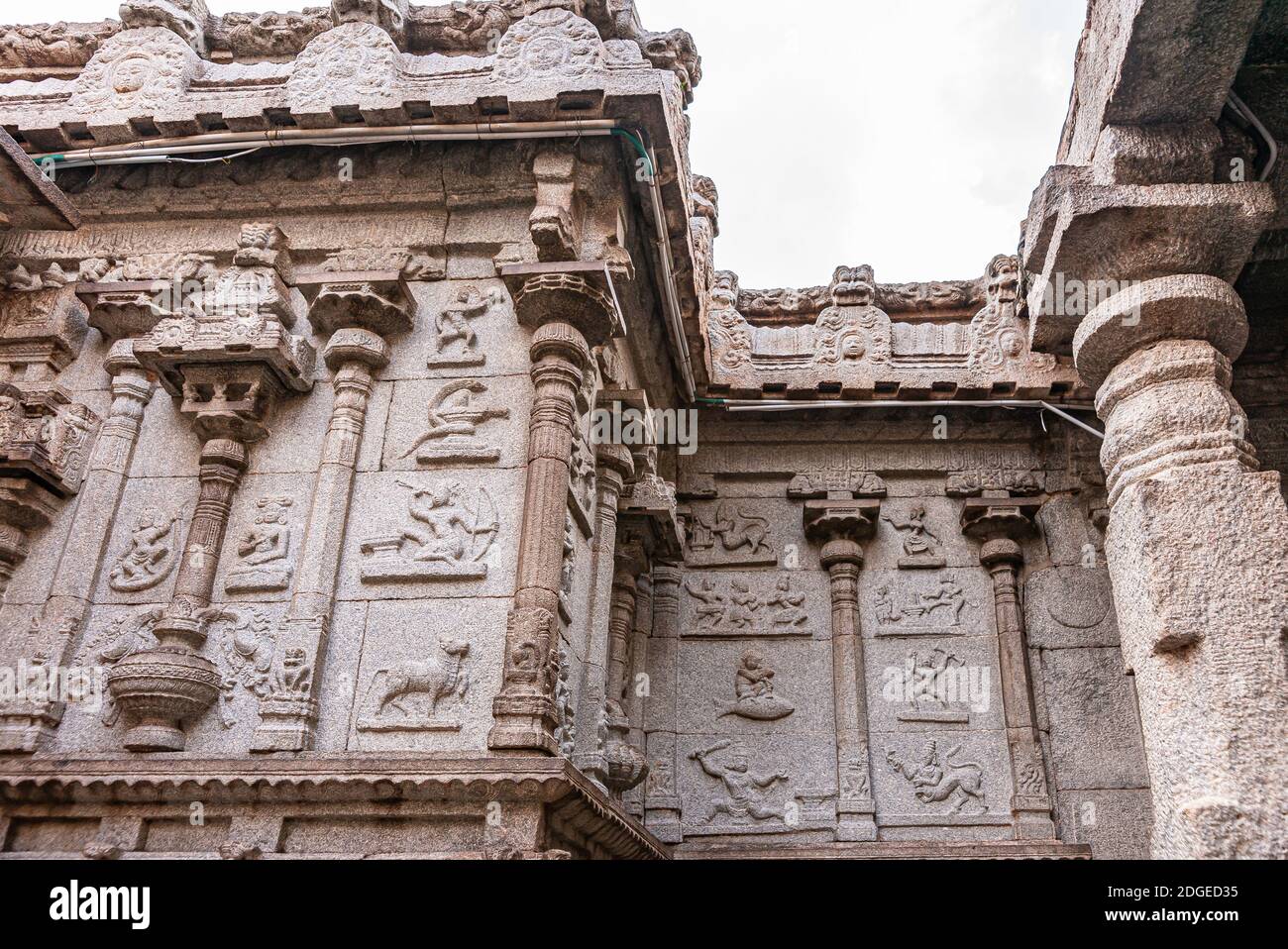 Hampi, Karnataka, India - November 4, 2013: Virupaksha Temple complex. Astrological symbols chiseled in beige brown stone facade at Shiva Sanctum unde Stock Photo
