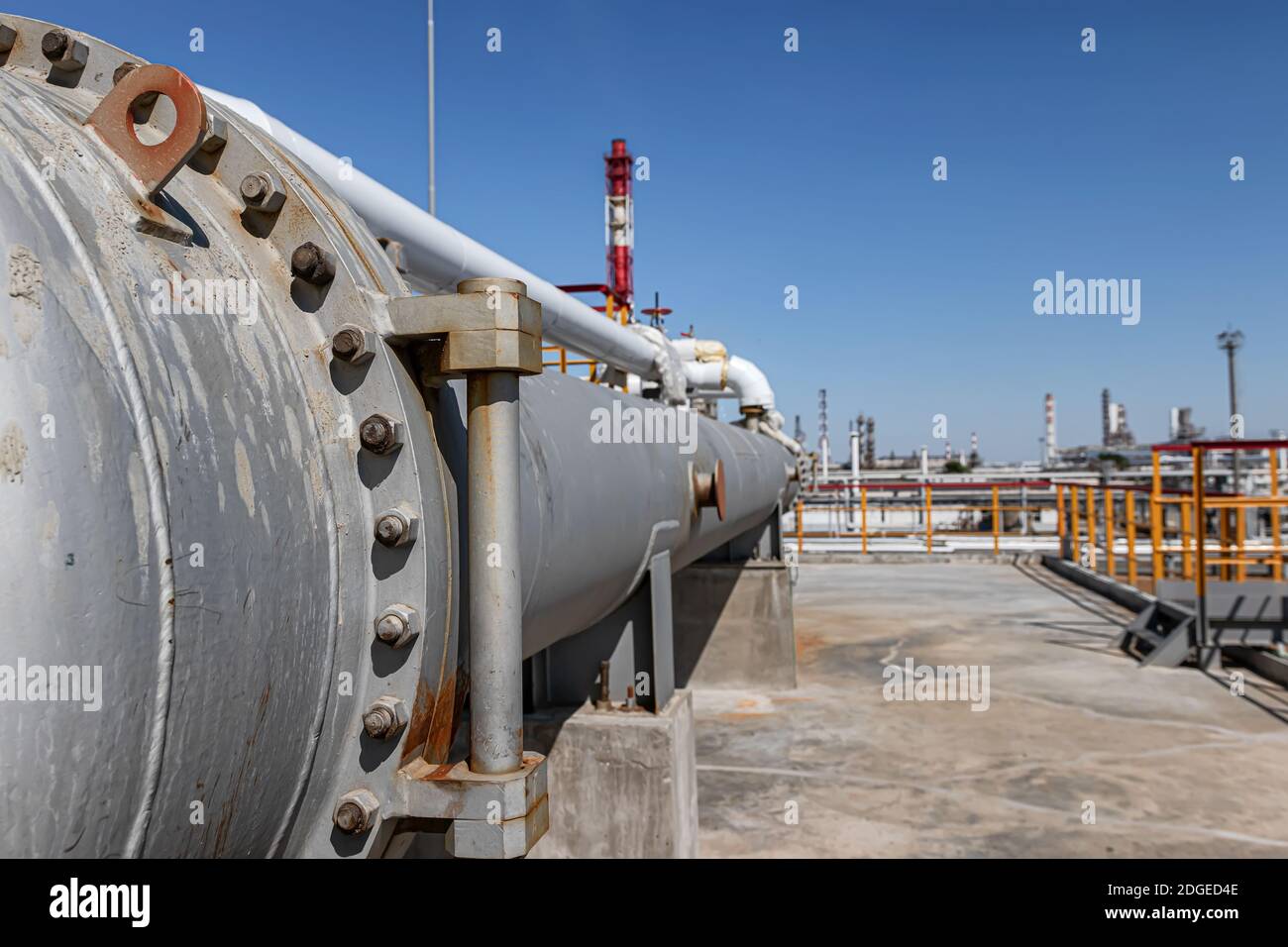 Long heat exchanger at top maintenance site of new refinery plant Stock Photo