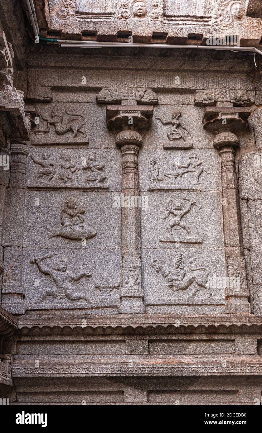 Hampi, Karnataka, India - November 4, 2013: Virupaksha Temple complex. Portrait of Astrological symbols chiseled in beige brown stone facade at Shiva Stock Photo