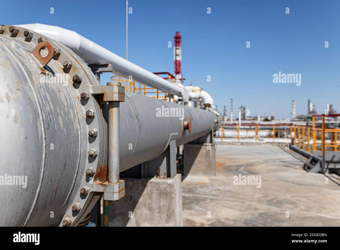 Long heat exchanger at top maintenance site of new refinery plant Stock Photo