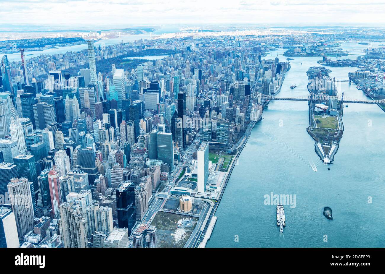 Aerial view of Manhattan buildings and Roosevelt Island on the East River from helicopter Stock Photo