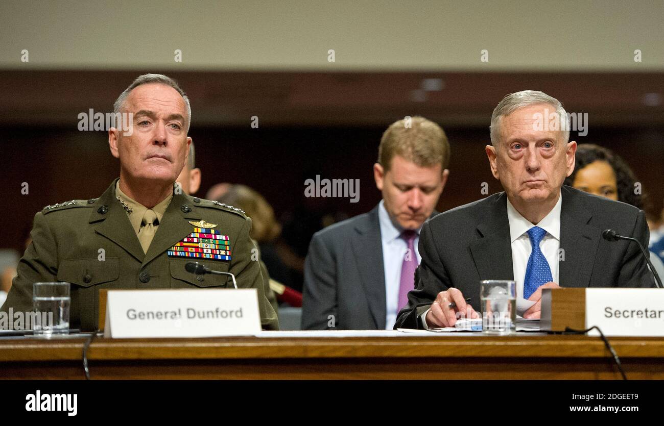 United States Secretary of Defense James N. Mattis, right, and General Joseph F. Dunford, Jr., US Marine Corps, Chairman of the Joint Chiefs of Staff, left, give testimony before the US Senate Committee on Armed Services on 'the Department of Defense budget posture in review of the Defense Authorization Request for Fiscal Year 2018 and the Future Years Defense Program' on Capitol Hill in Washington, DC on Tuesday, June 13, 2017.Photo by Ron Sachs / CNP/ABACAPRESS.COM Stock Photo