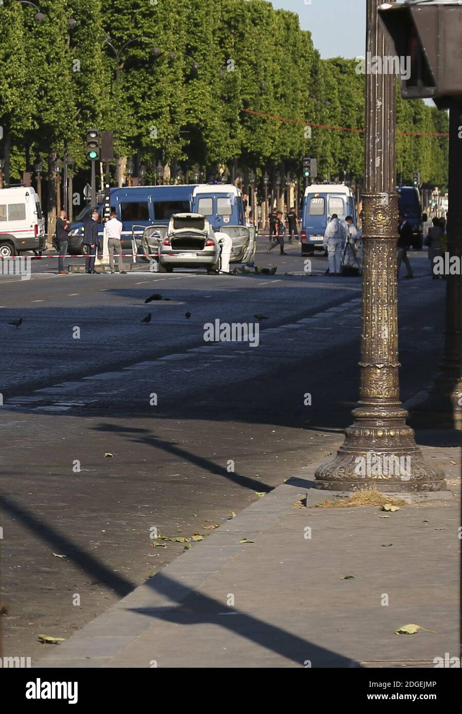 Police officers patrol near the Champs-Elysees avenue on June 19, 2017 in  Paris, France. A car rammed into a police van Monday on the Champs-Elysees  avenue in Paris before bursting into flames,