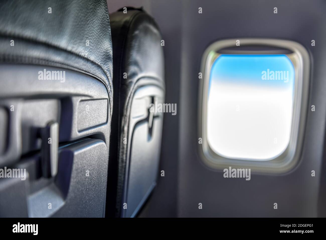 Seat and window in an airplane Stock Photo