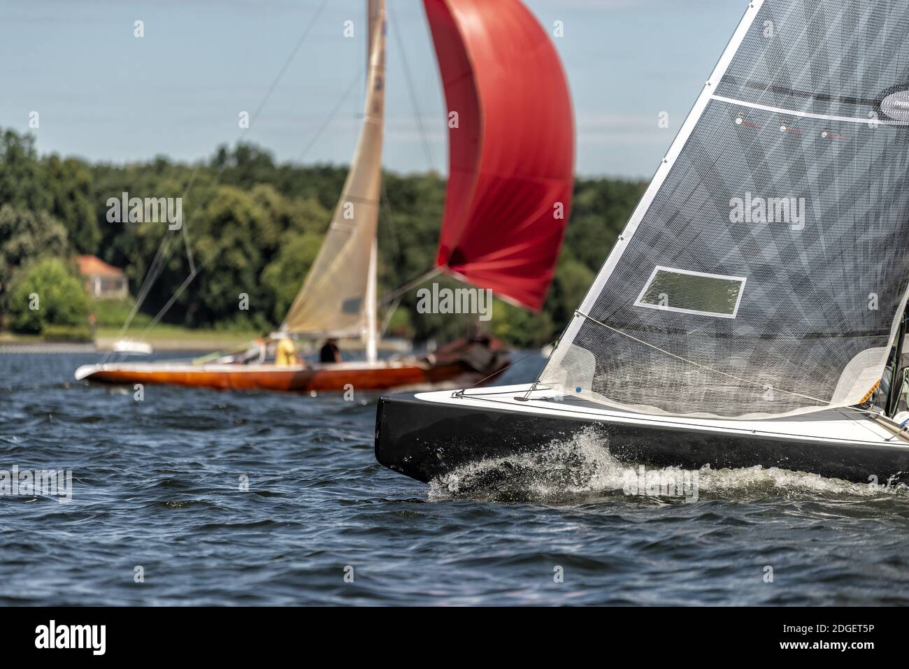 Classic sailing yacht on a lake in a regatta Stock Photo - Alamy