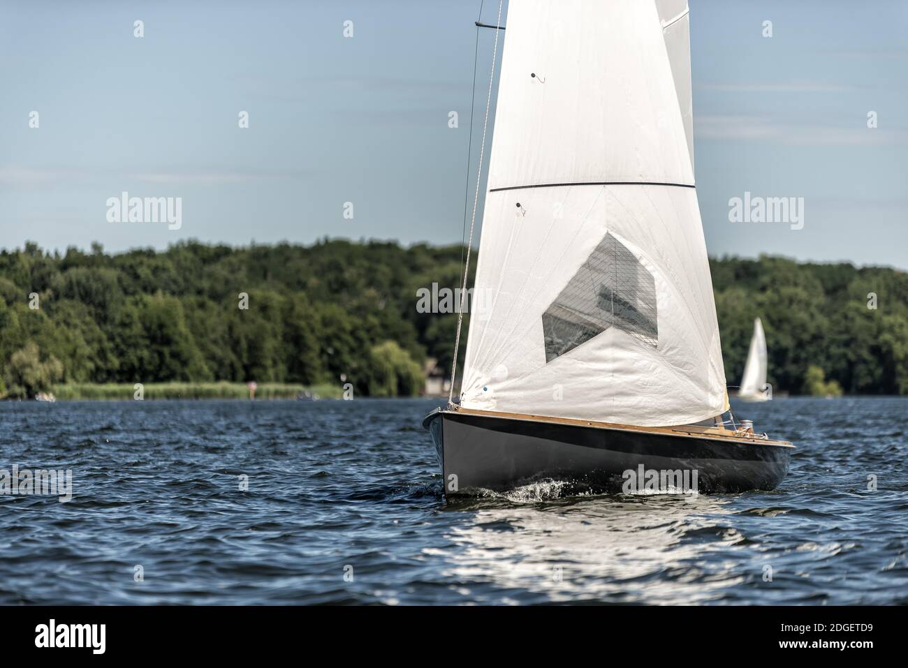 Classic sailing yacht on a lake in a regatta Stock Photo - Alamy