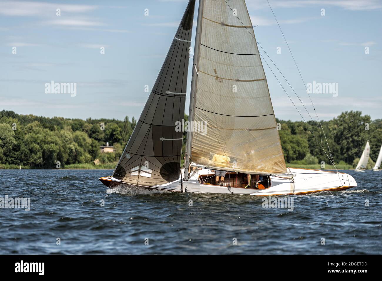 Classic sailing yacht on a lake in a regatta Stock Photo - Alamy