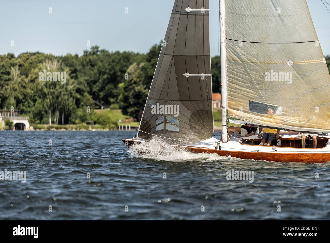 Classic sailing yacht on a lake in a regatta Stock Photo - Alamy