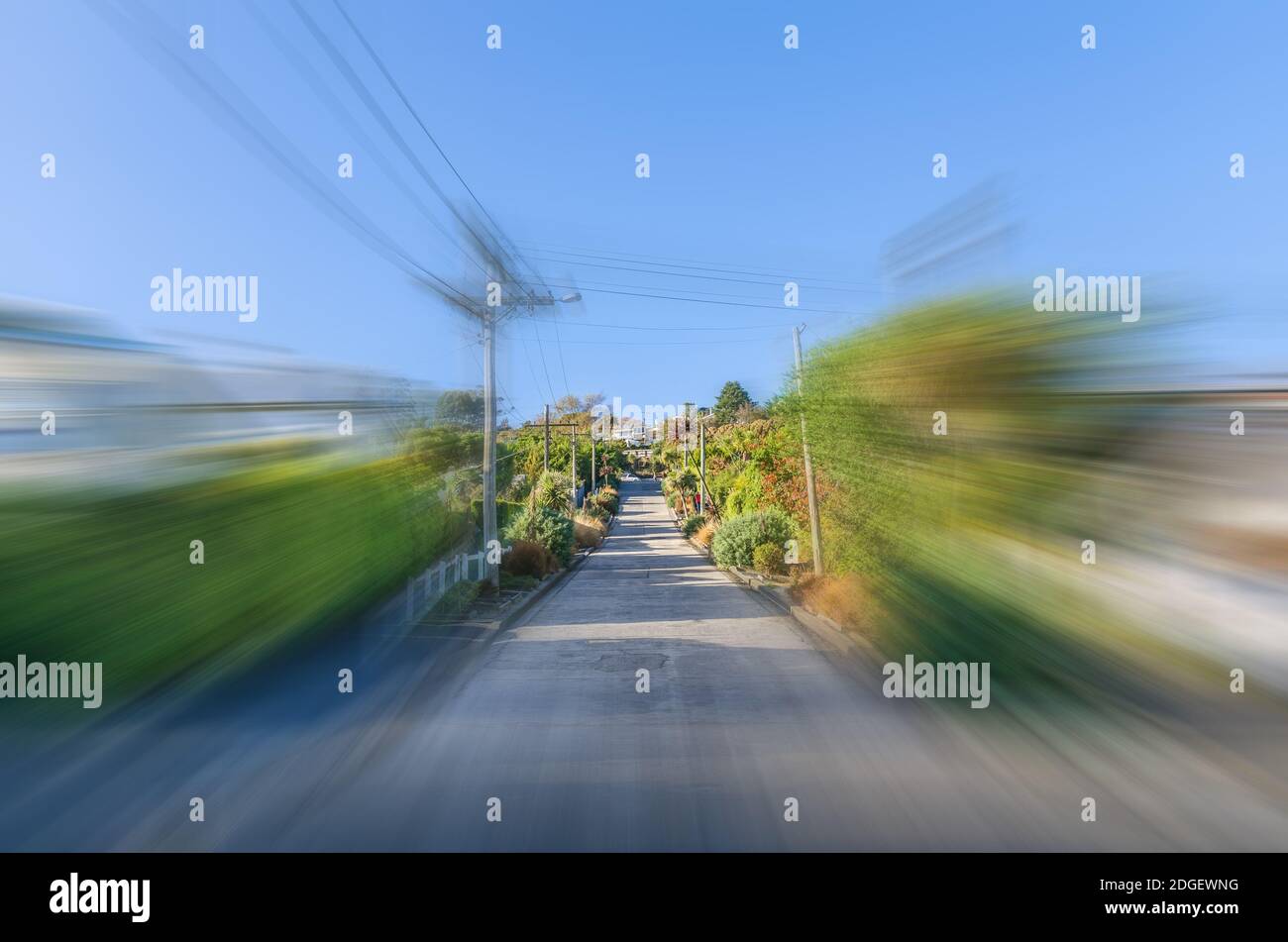Baldwin Street in motion blur which is located in Dunedin,New Zealand is the world steepest street in the world. Stock Photo