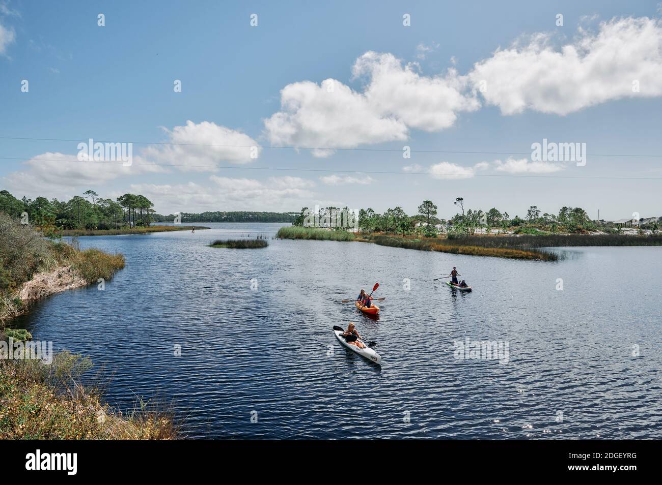 Kayaking and paddleboarding on Western Lake, a coastal dune lake in Grayton Beach State Park, in the Florida panhandle county of South Walton, USA. Stock Photo