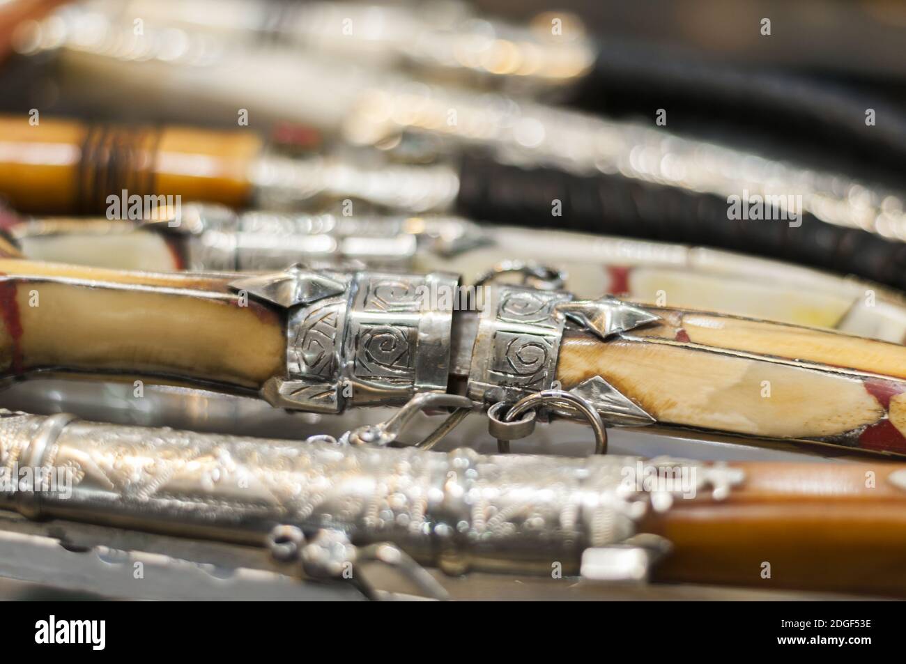 Background of different oriental daggers in a souk. Stock Photo