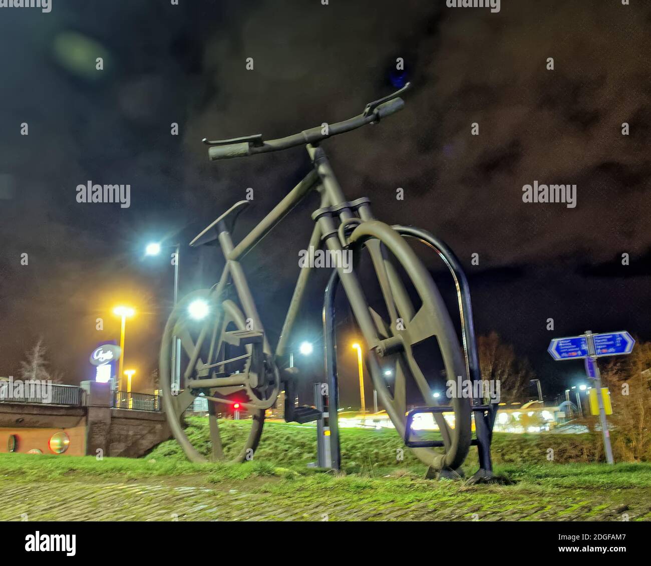 Clydebank, Glasgow, Scotland, UK. 9th December, 2020. UK Weather: Cold, damp on the Forth and clyde canal the flying swan bridge and the Bankies bicycle statue featuring the biggest bike lock in the world are in the early morning darkness of winter  .Credit: Gerard Ferry/Alamy Live News Stock Photo