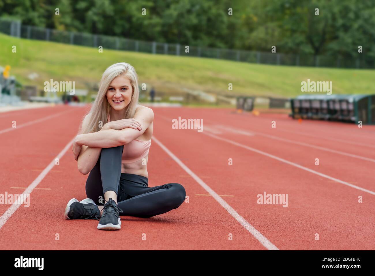 A Young Athletic College Athlete Prepares For A Track Meet At A University Stock Photo