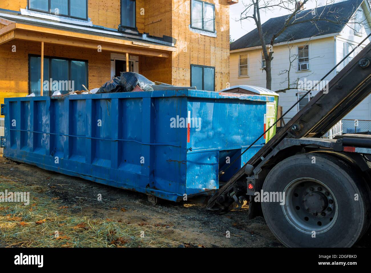 Recycling container trash dumpsters being full with garbage Stock Photo
