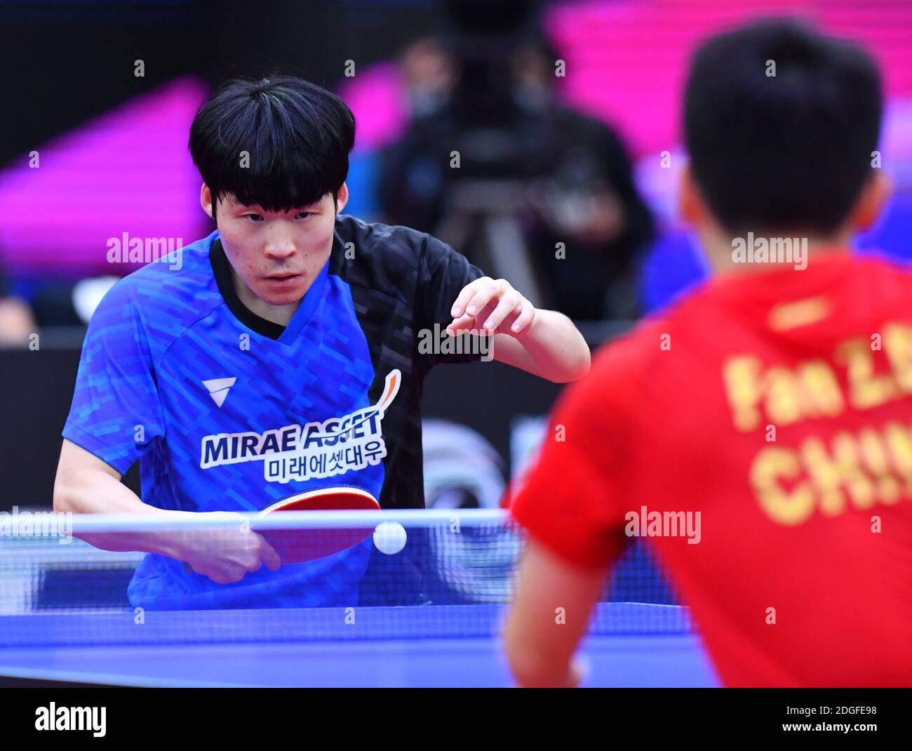 South Korean table tennis player Jang Woojin plays against Chinese