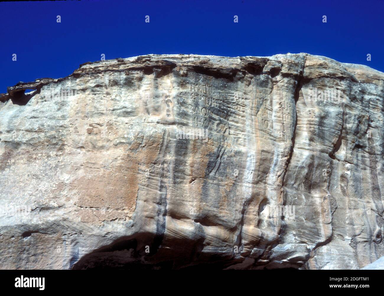 Petra Inscriptions Nabatean inscription high up on a cliff face in Petra, Jordan Stock ...
