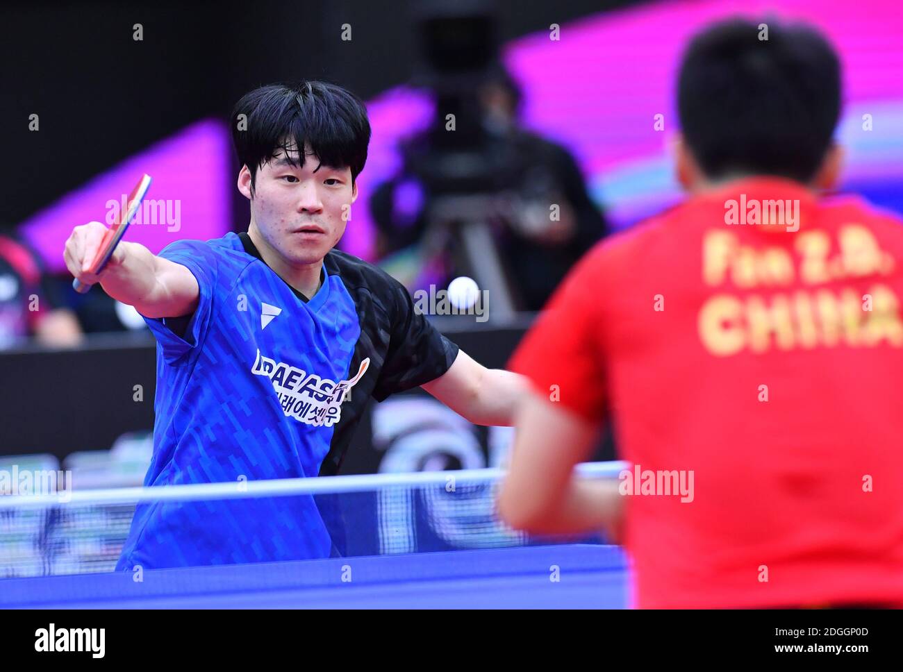 South Korean table tennis player Jang Woojin plays against Chinese