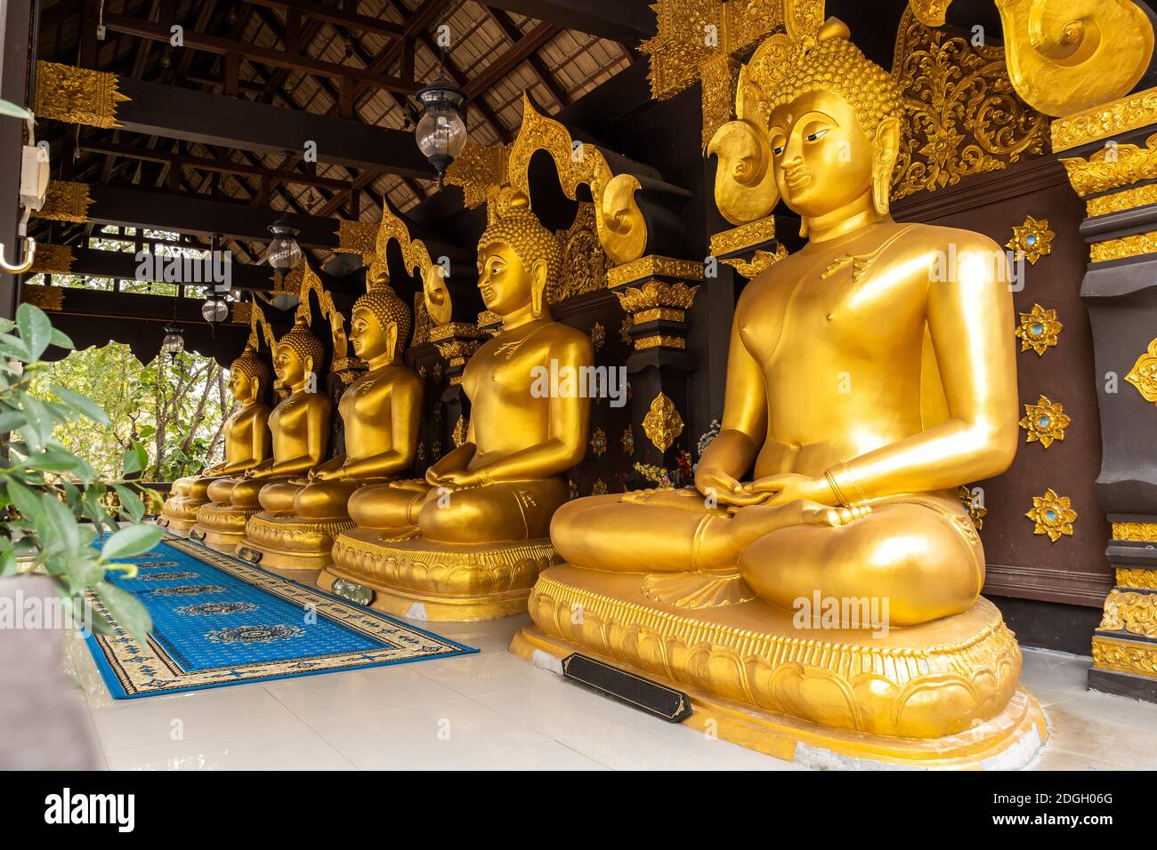 Row of Buddha Statues in Wat Phra That Doi Phra Chan Stock Photo
