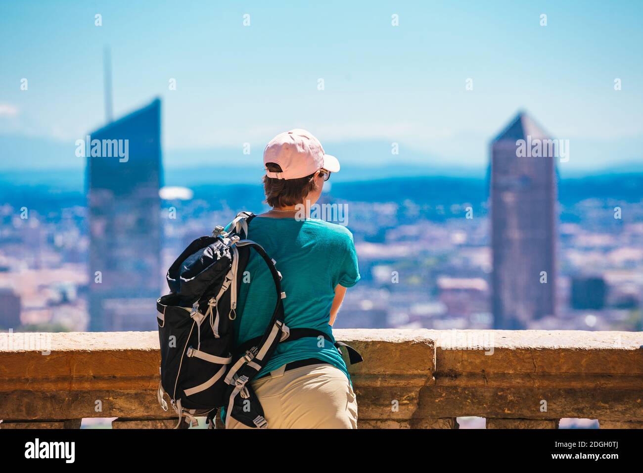 Woman enjoying great view on Lyon city with skyscrapers during the day time in France Stock Photo