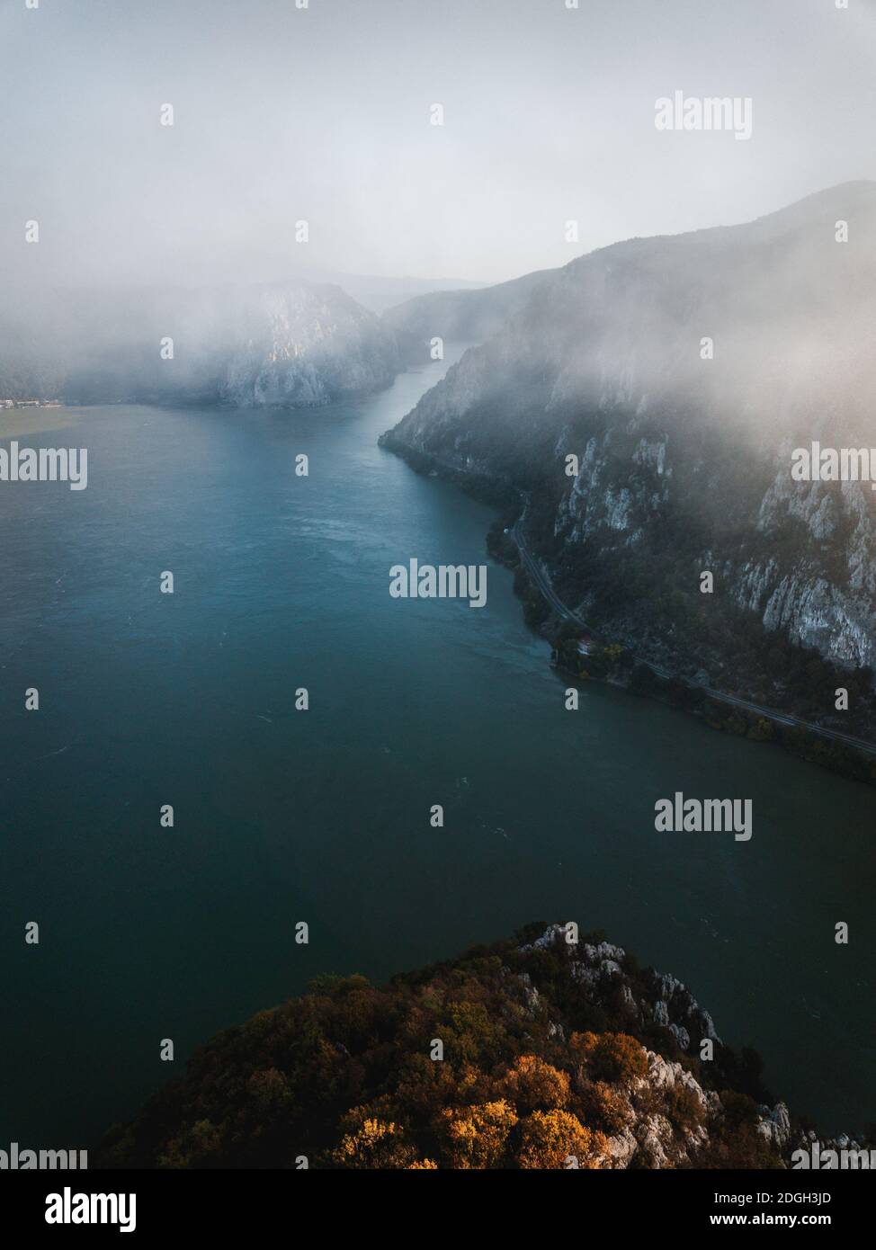 Foggy autumn nature landscape in Dubova Bay. Danube River, Romania Stock Photo
