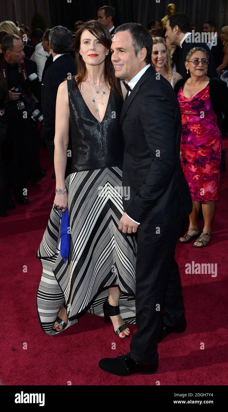 Mark Ruffalo and Sunrise Coigney arriving for the 85th Academy Awards at the Dolby Theatre, Los Angeles. Stock Photo