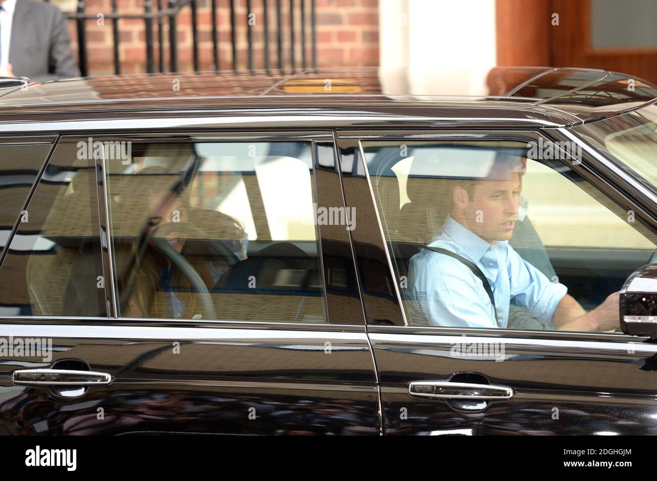 Prince William and Kate Middleton, The Duke and Duchess of Cambridge drive away from the Lindo Wing of St Mary's Hospital with their new born baby boy, Paddington, London. Stock Photo