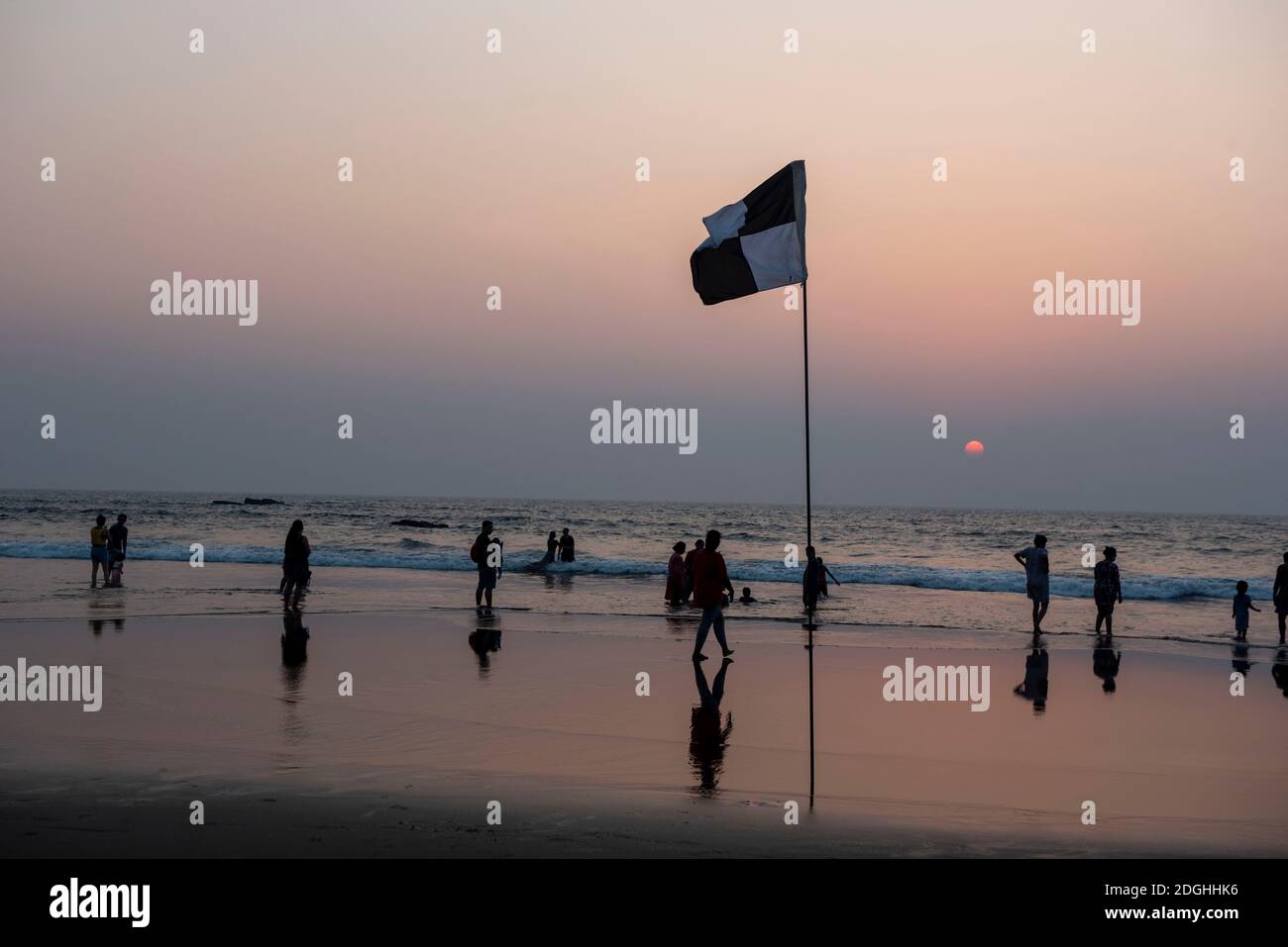 Goa/ India 09 November 2020  Lifeguard flag during sunset at Vagator Beach Goa Stock Photo