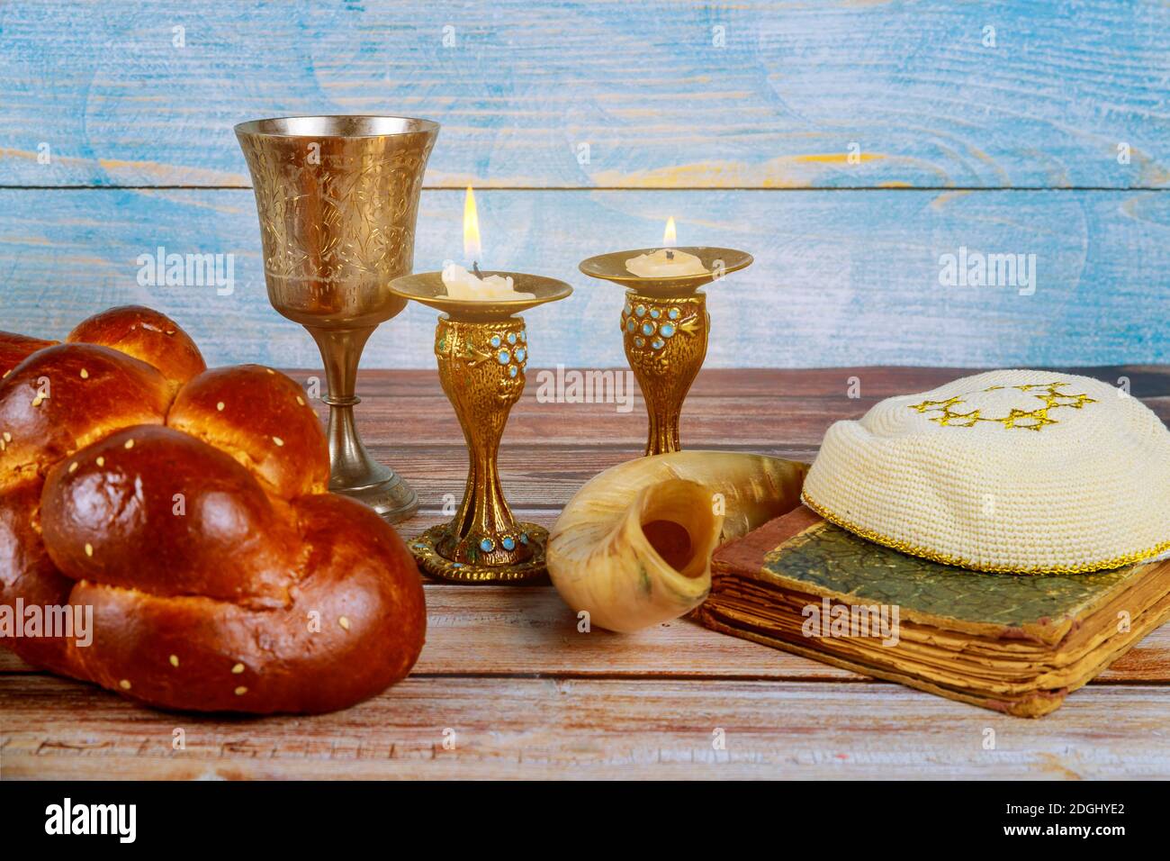 Shabbat challah bread, shabbat wine and candles on the table Stock
